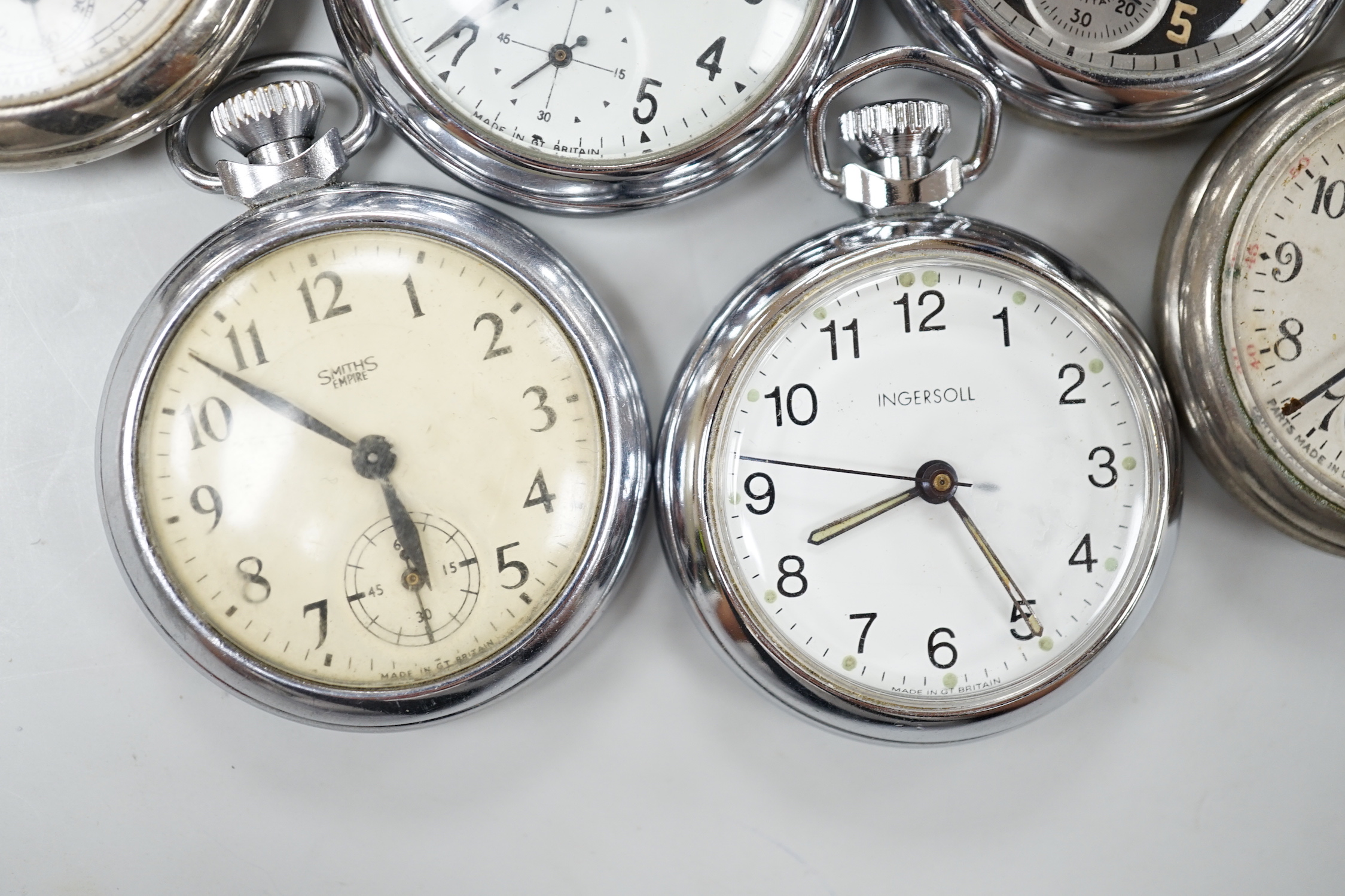 Ten assorted base metal pocket watches including Ingersoll and Smiths.